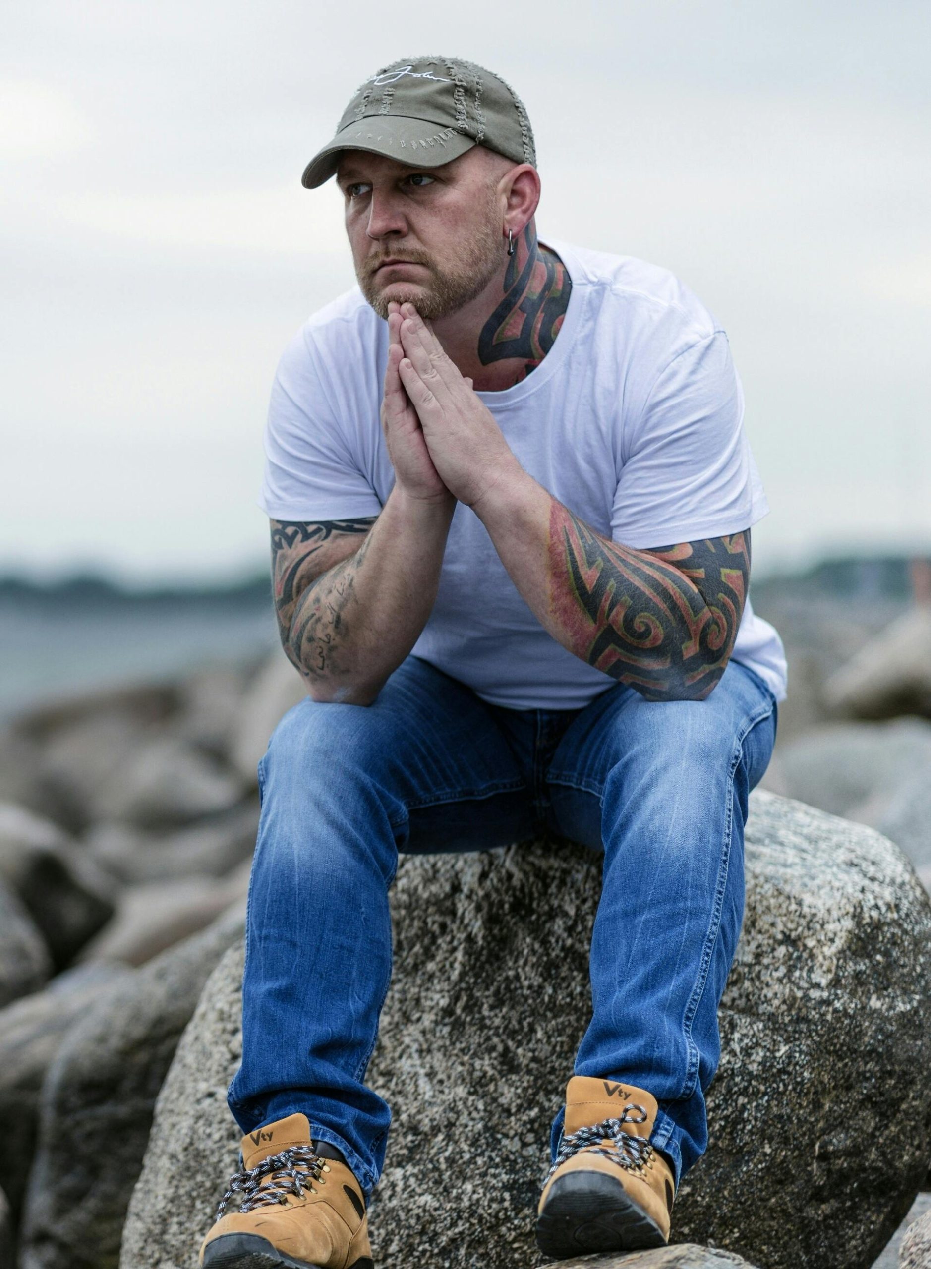 Man thinking while looking from a rock