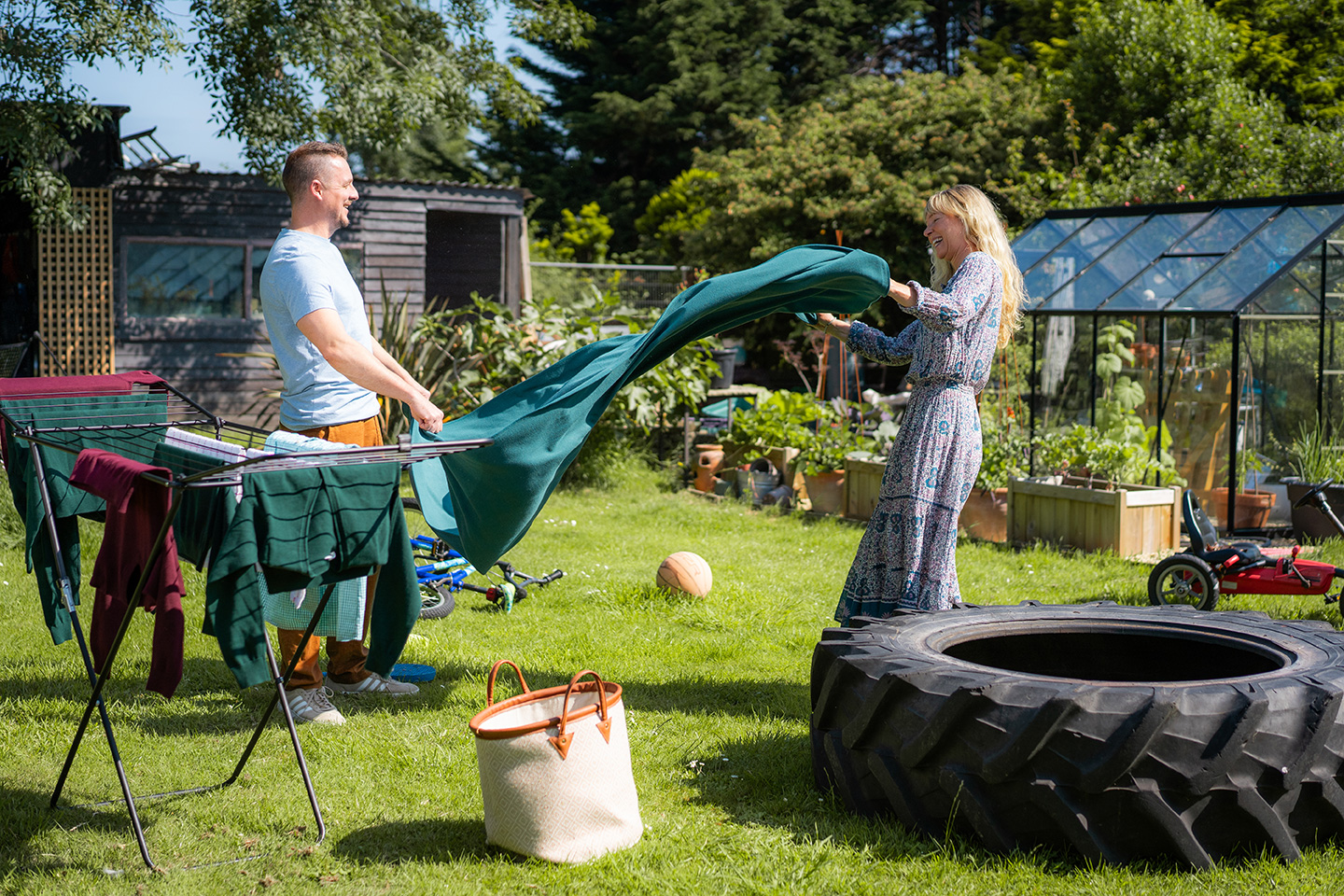 A man and woman working in a garden